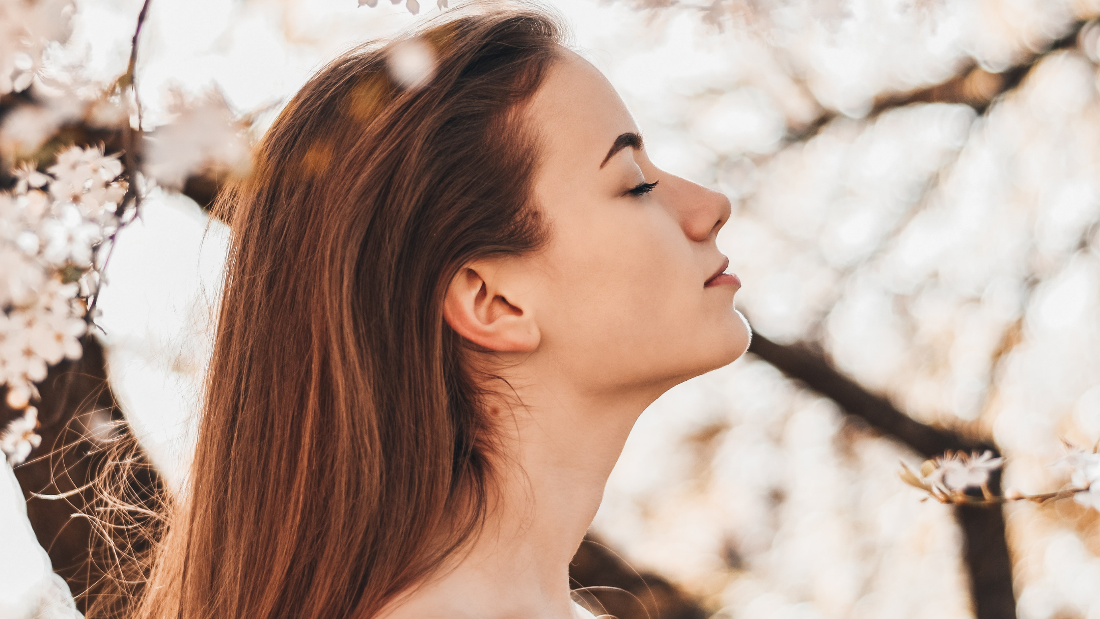 girl by a blossom tree
